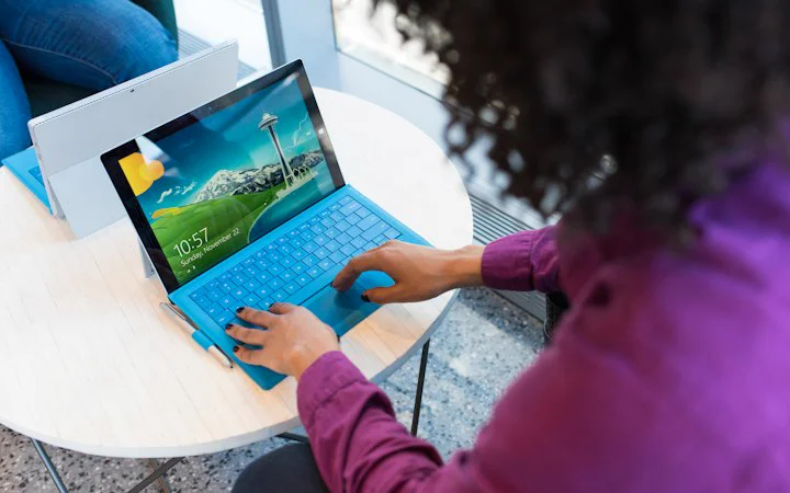 Employee checking details on a laptop